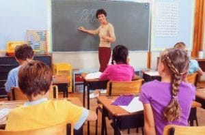 There are six benches in the classroom.