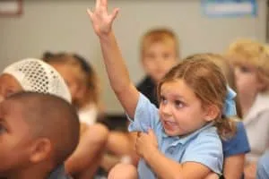There is a girl in the classroom
